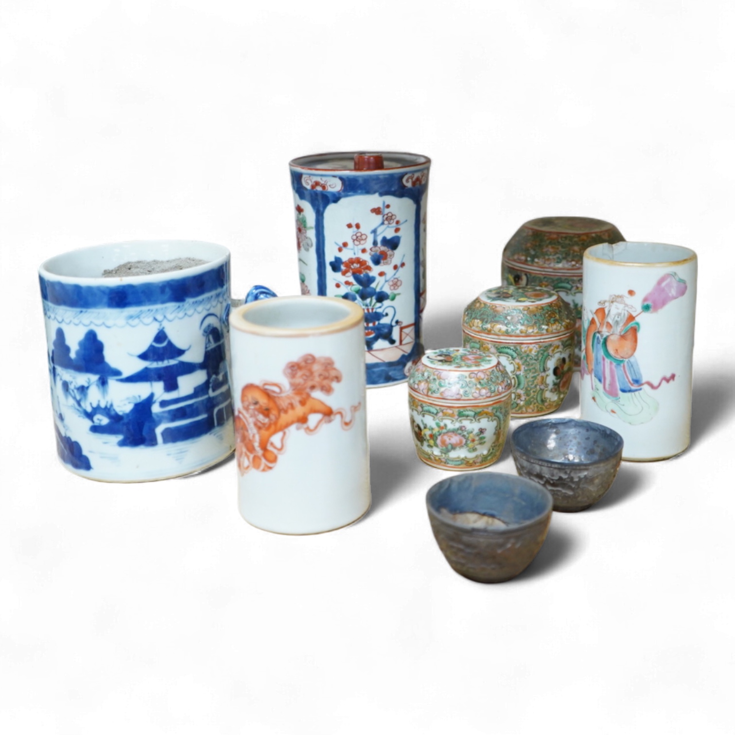 A collection of Chinese ceramics to include a blue and white mug, set of three graduated Canton jars and covers and two cylindrical brush washers